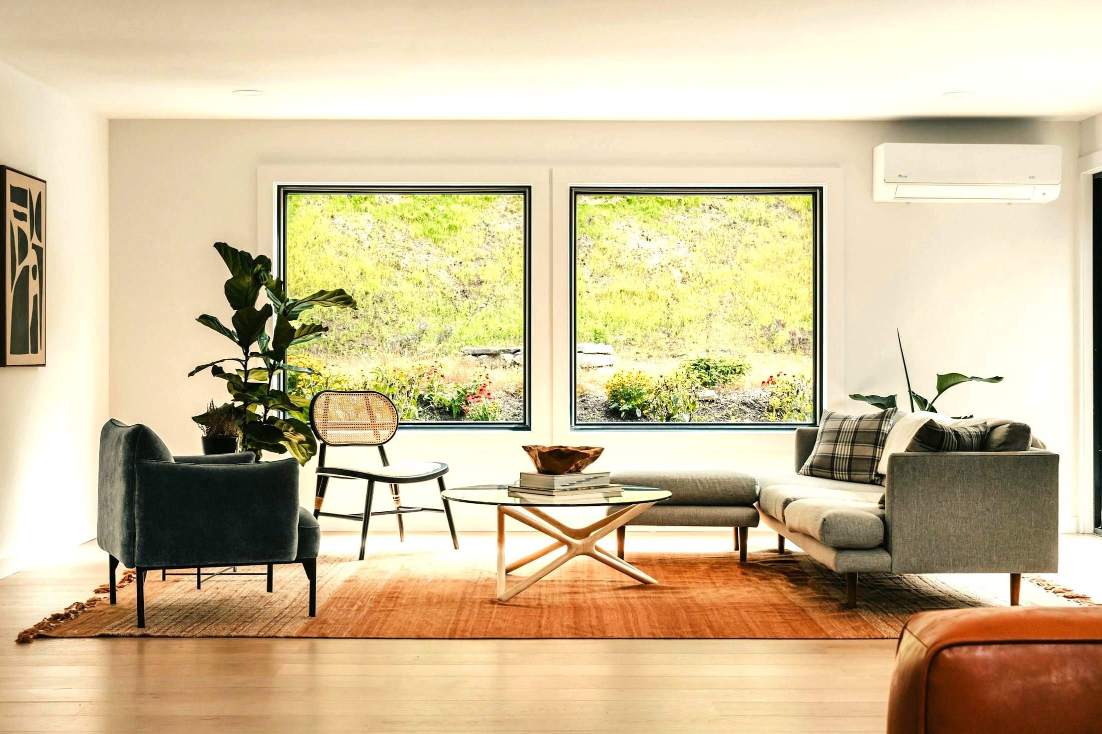 A bright room with tall windows and daylight across the floor